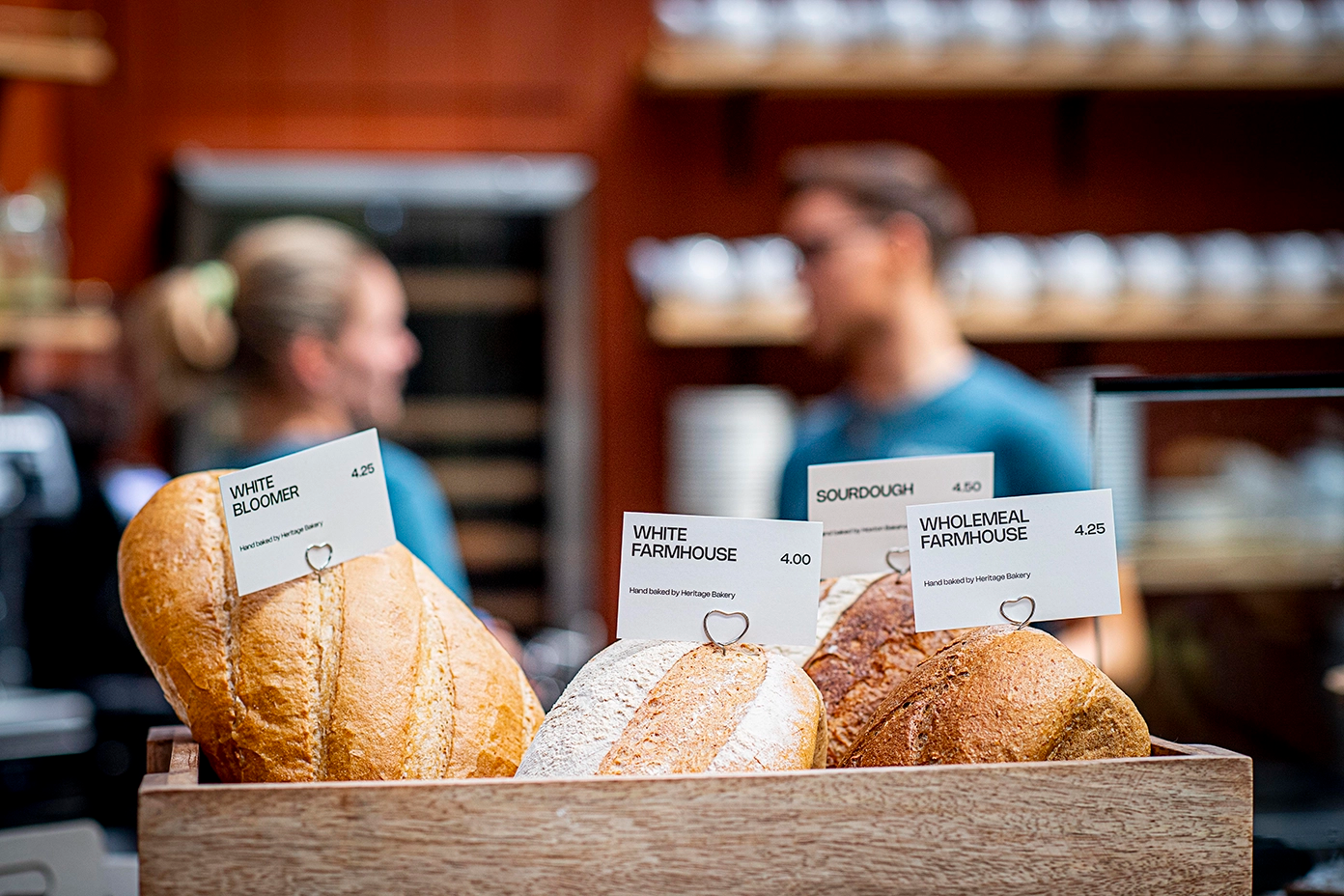 Person at standing desk working on laptop