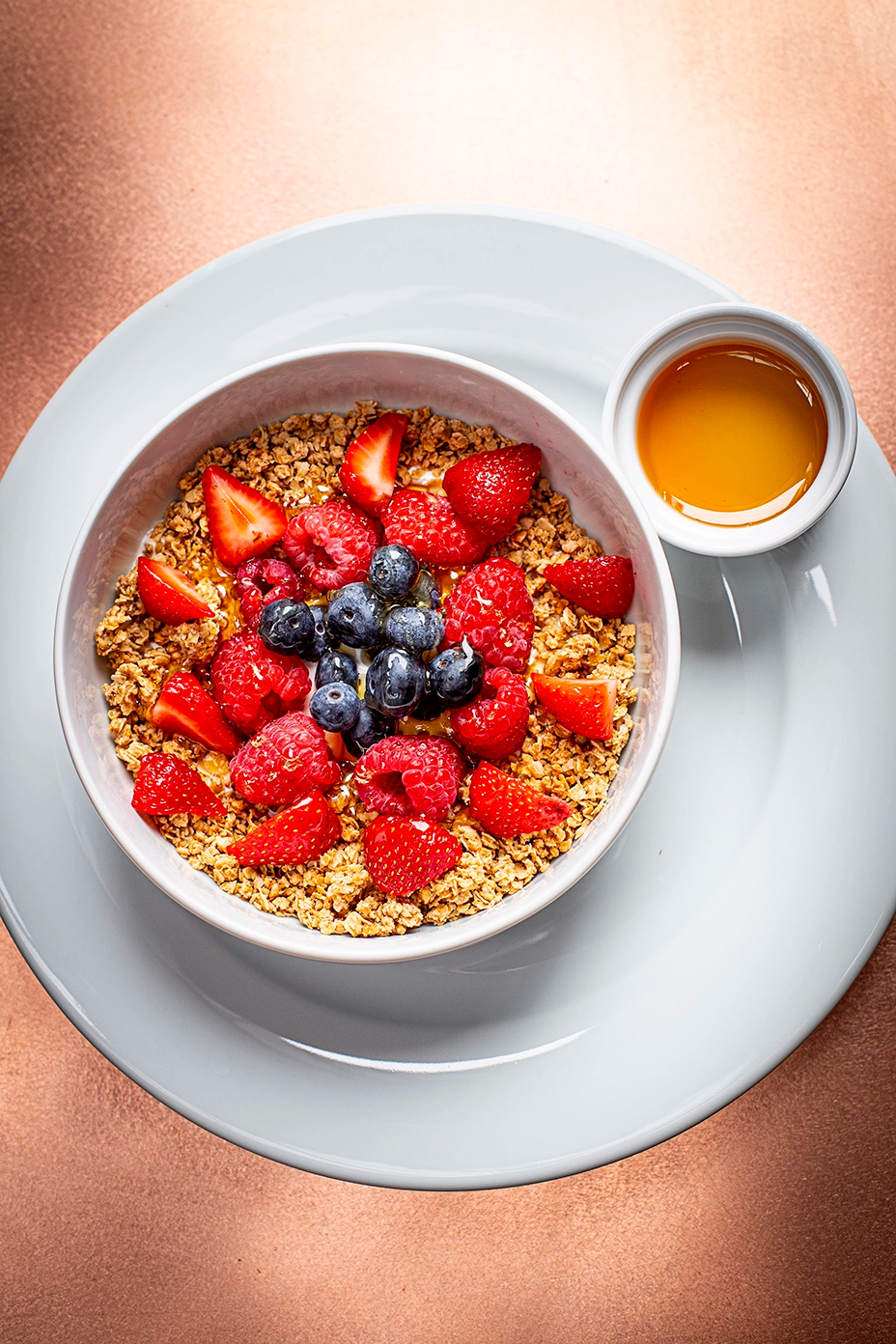 Person sitting on floor working on laptop